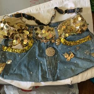 HANDMADE DENIM HANDBAG WITH GOLD DETAILS.